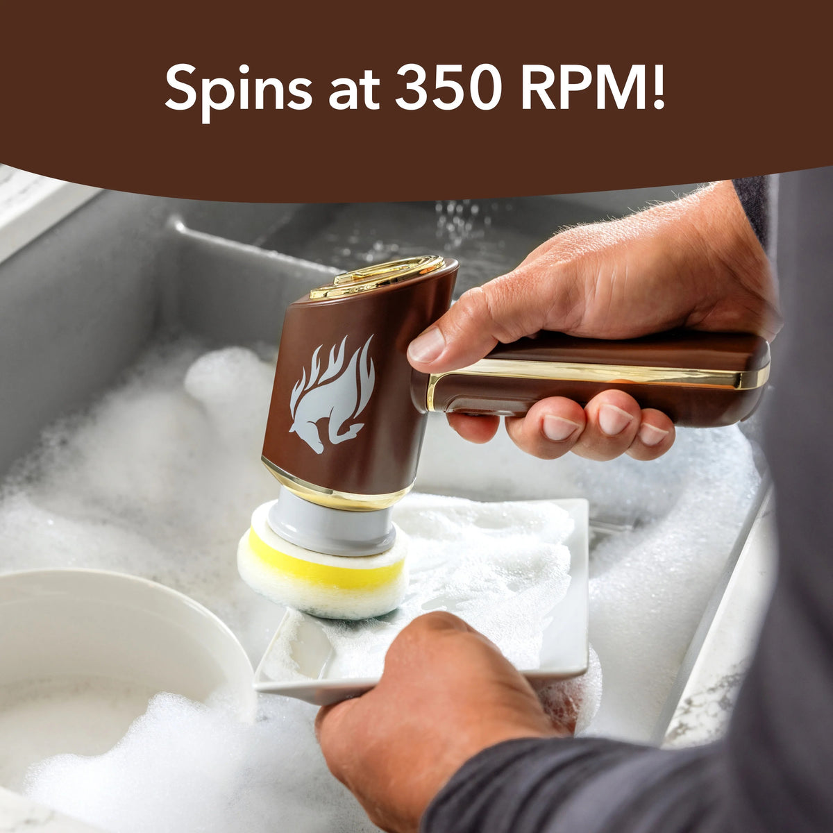 A person holds a brown and gold rotary cleaning sponge in a soapy sink, with the text 'Spins at 350 RPM!' at the top.