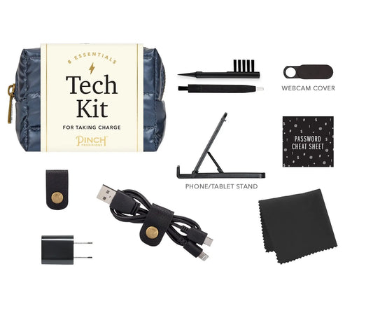 Navy blue quilted pouch with gold zipper and cream-colored label reading ’tech kit for taking charge’ by pinch products.