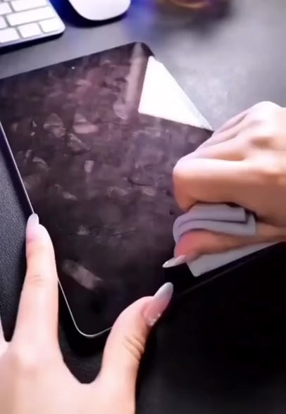 Clean My Tech polishing cloth cleaning multiple Apple products.
