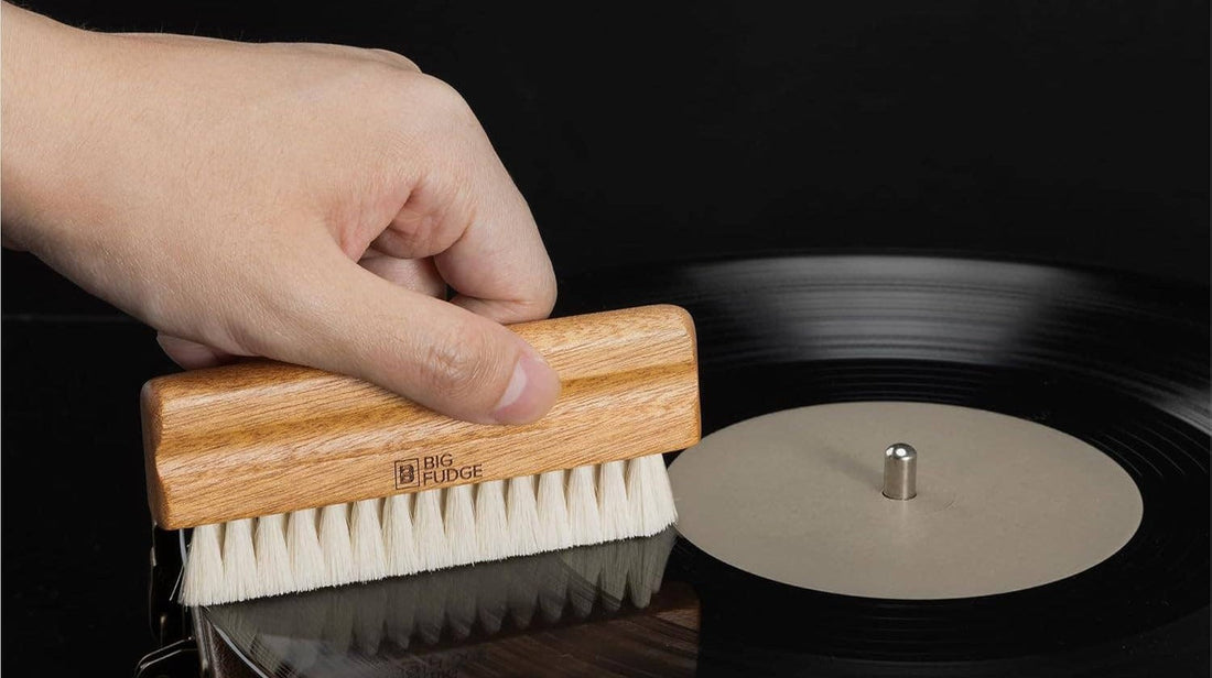Hand dry-brushing a vinyl record with the Big Fudge Sapele wood goat hair brush from the Collector's Edition Record Cleaning Brush Kit