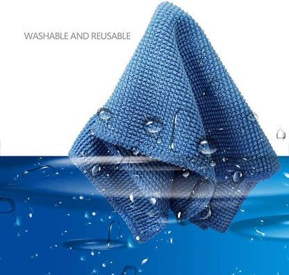 a blue microfiber cloth submerged in water 