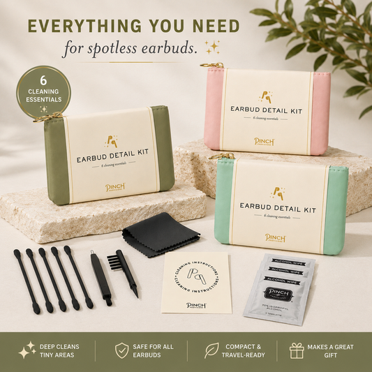 Punch Earbud Detail Kit shown with three compact storage cases in olive green, pink, and mint green, along with cleaning tools, a black microfiber cloth, instruction card, and sachets on a light stone background. Text at the top reads 'EVERYTHING YOU NEED for spotless earbuds' and a badge says '6 Cleaning Essentials'.