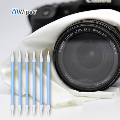 AAWipes brand lens cleaning swab set shown next to a Canon zoom lens with a white microfiber cloth in the background.