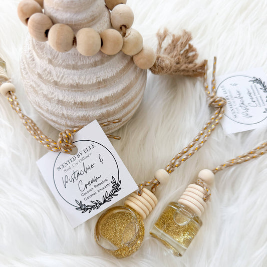 small bottles and wooden beads on a soft white surface