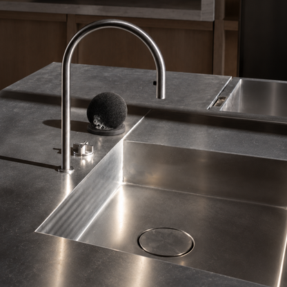 Modern ORB Sponge displayed on kitchen countertop with drying base