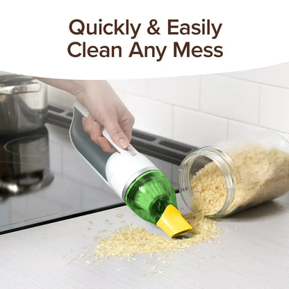 Cleaning tool being used to clean spilled rice from a bottle on a kitchen counter.
