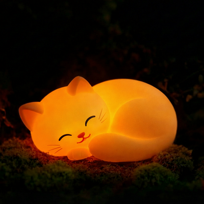 Cat-shaped night light glowing in a dark setting