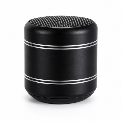 A black cylindrical portable speaker with a textured top grille and two thin silver metallic rings on the side, shown against a plain white background.