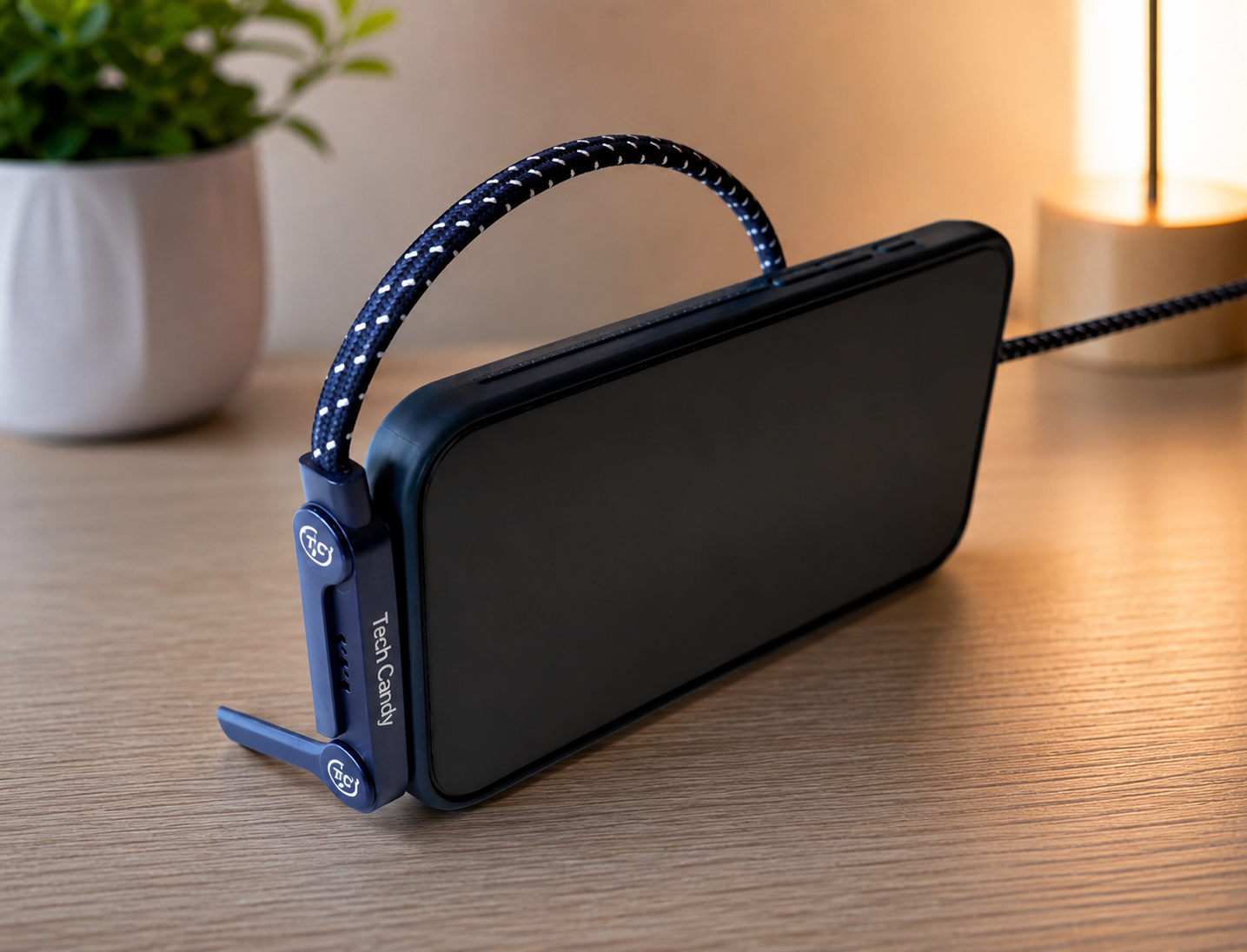 blue and white usb-c charging cable with stand plugged into a phone sitting up in horizontal position 