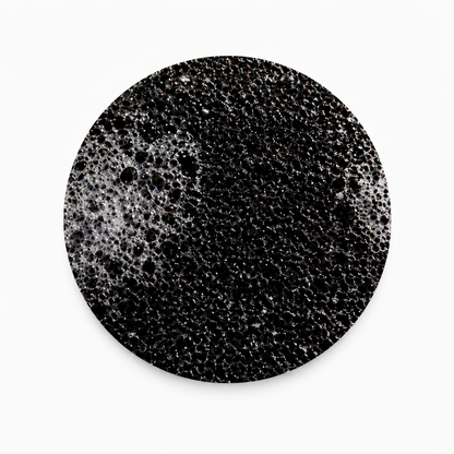 close up of the black ORB sponge on a white background