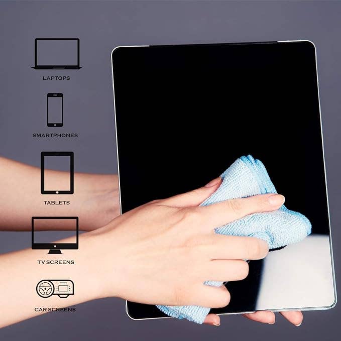 hand holding a blue microfiber cloth to clean a iPad screen