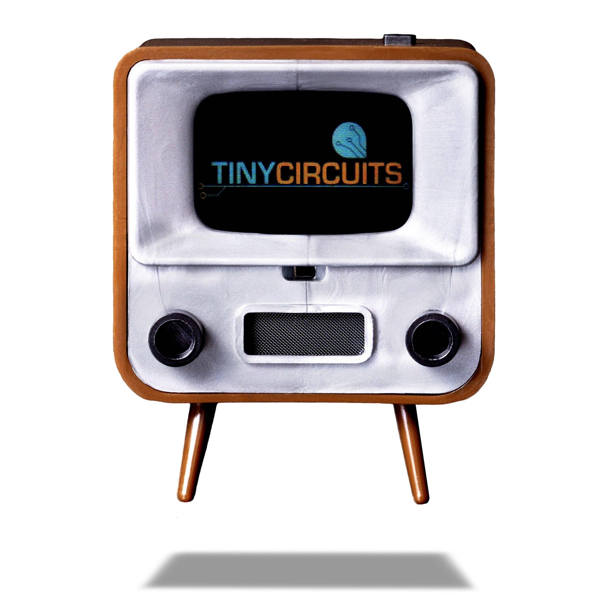 Vintage-style electronic device with 'Tiny Circuits' logo on a white background