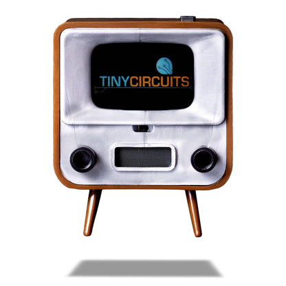 Vintage-style electronic device with 'Tiny Circuits' logo on a white background