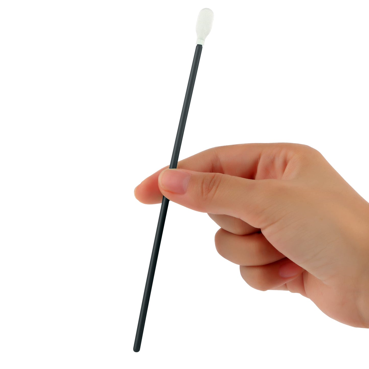 Hand holding a black swab with a white tip against a white background