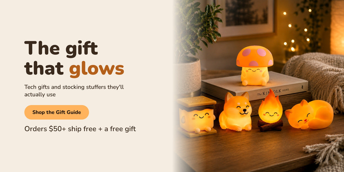 The gift that glows. Tech gifts and stocking stuffers they'll actually use. Orders $50+ ship free plus a free gift. Shop the Holiday Gift Guide with World of Mushi night lights: the mushroom, s'more, dog, fire and cat glowing on a cozy wood table.