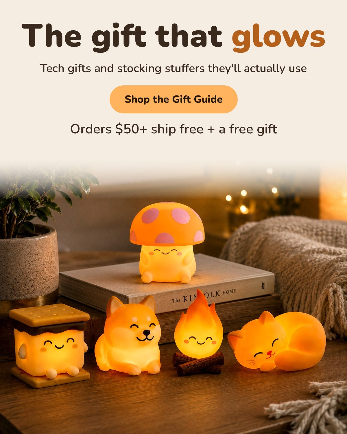 The gift that glows. Orders $50+ ship free plus a free gift. World of Mushi night lights glowing on a wood table: the mushroom, s'more, dog, fire and cat.