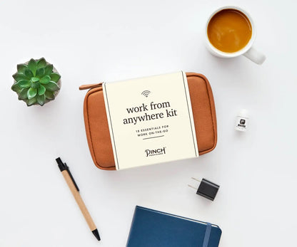 Work From Anywhere Kit in Cognac featuring 18 tech, office, and personal care essentials in a stylish clamshell organizer pouch.