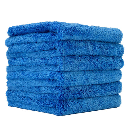 A stack of six folded blue microfiber towels with a soft, plush texture, shown on a solid white background.