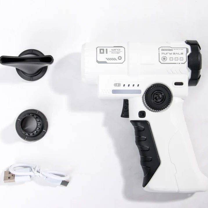 A white and black handheld device with a trigger-style handle, shown on a white background with two black circular attachments and a small white USB cable.