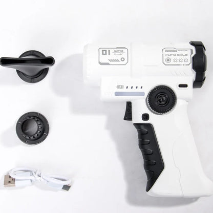 A white and black handheld device with a trigger-style handle, shown on a white background with two black circular attachments and a small white USB cable.