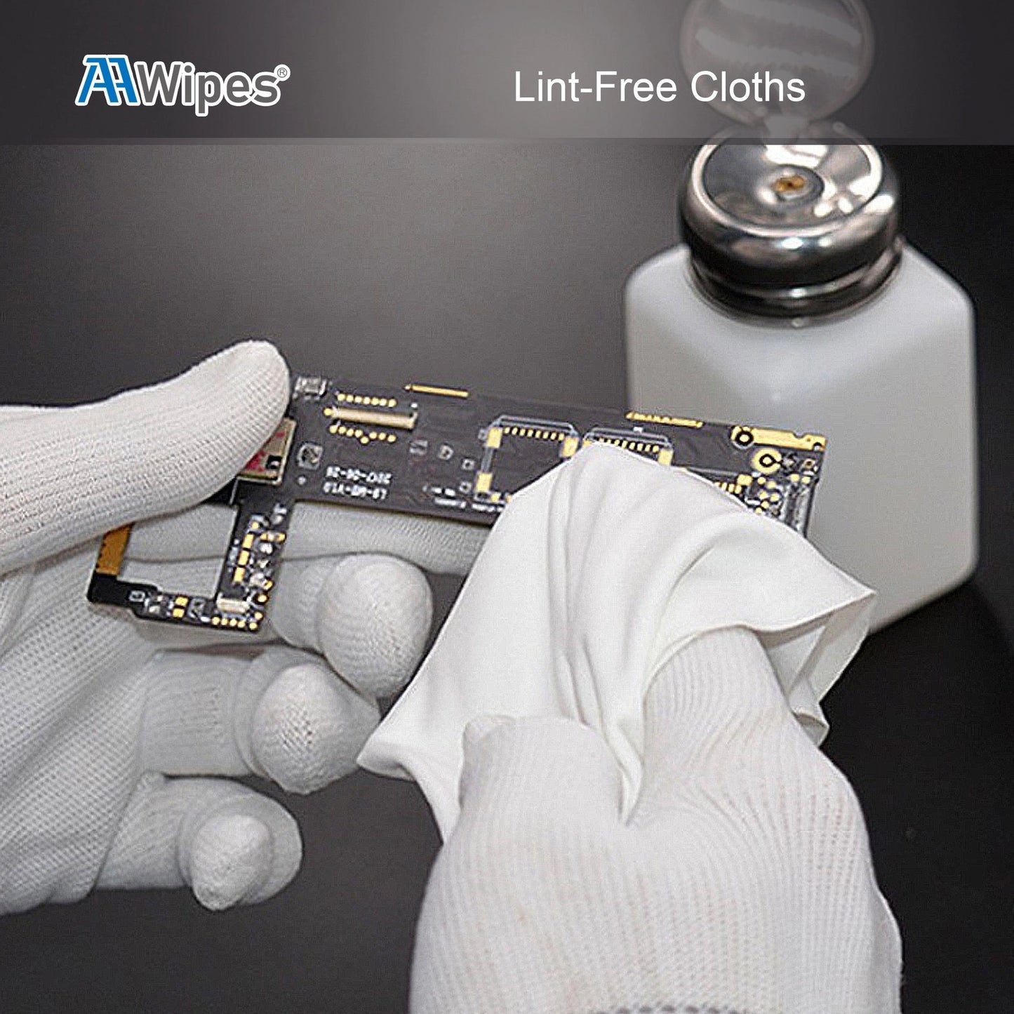 Hands with gloves uses cleanroom wipe to wipe a computer circuit board lint free.