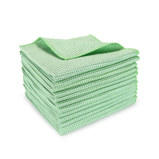 Stack of green microfiber cloths on a white background