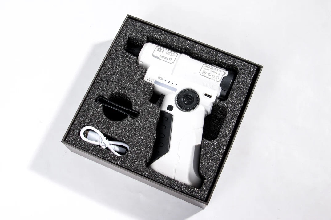 White handheld device with black components in a black foam-lined box on a white background