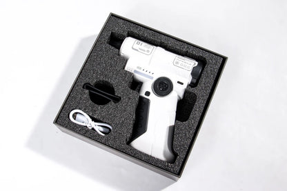 White handheld device with black components in a black foam-lined box on a white background