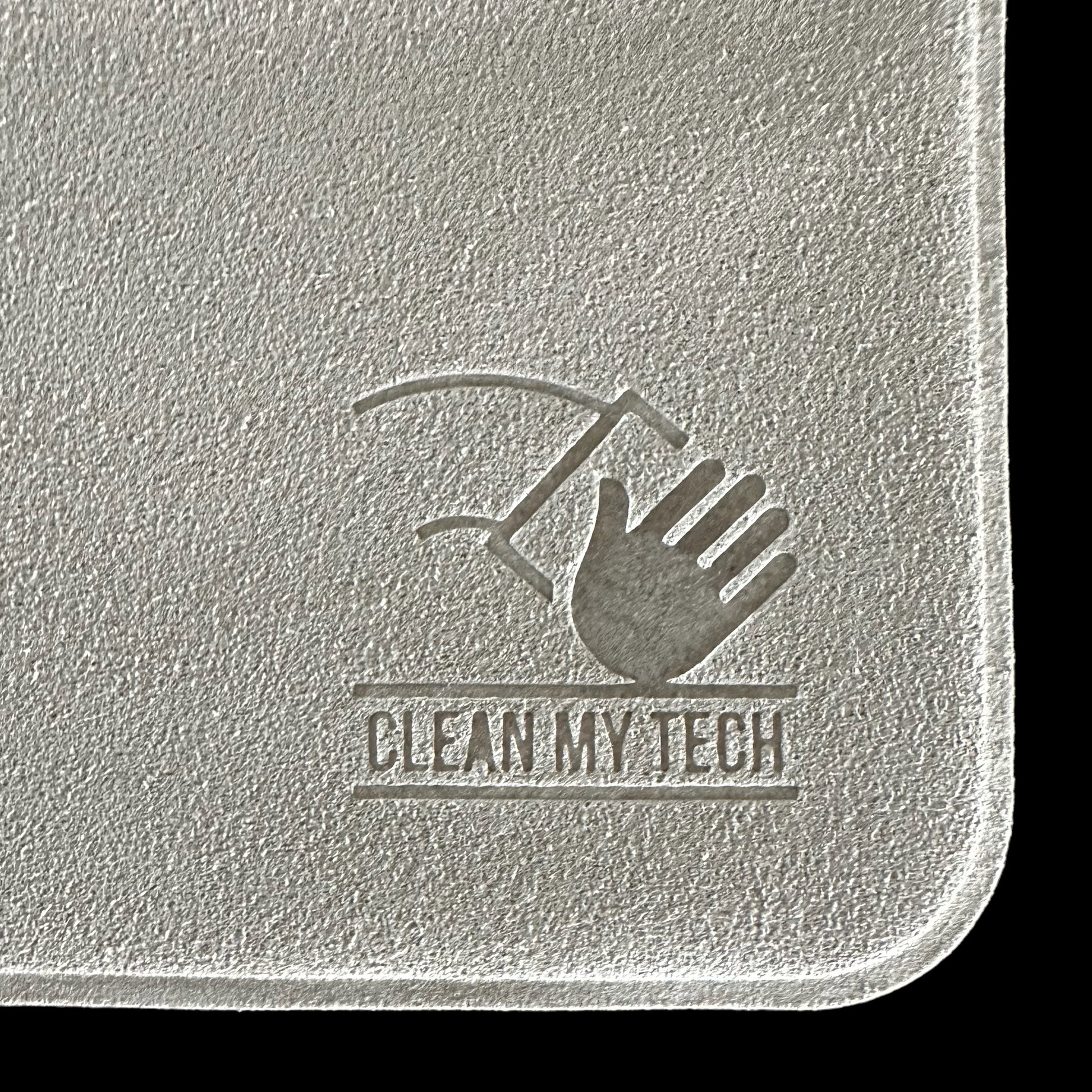 Close up of a Clean My Tech polishing cloth corner featuring a logo.