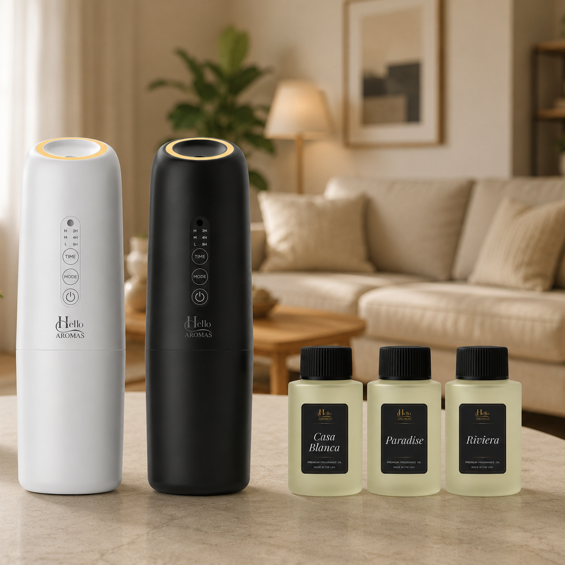black and white Hello Aromas Oasis plugin diffusers on table with 3 bottle of fragrance oil with sofa and table in background