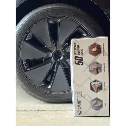 A box of 50 white microfiber cloths by smartrags, designed for cleaning various surfaces.