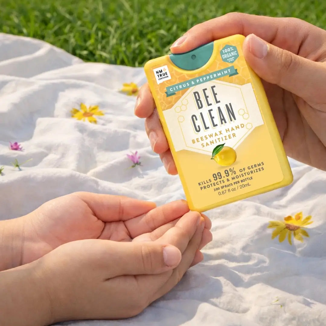 Yellow citrus and peppermint bee clean beeswax hand sanitizer spray with teal nozzle for organic hand care use