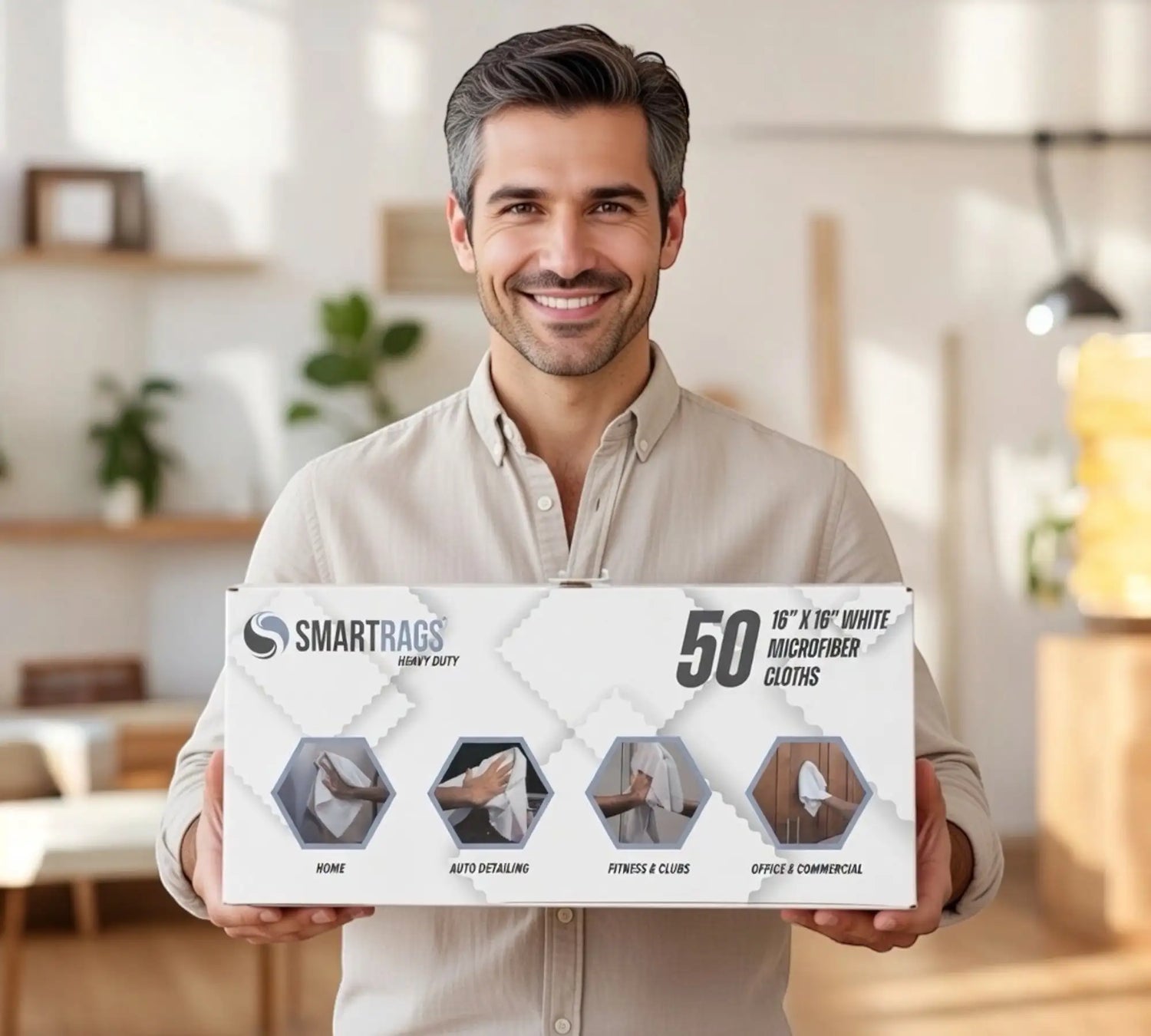 Man holding big box of 50 count white Smart Rags.