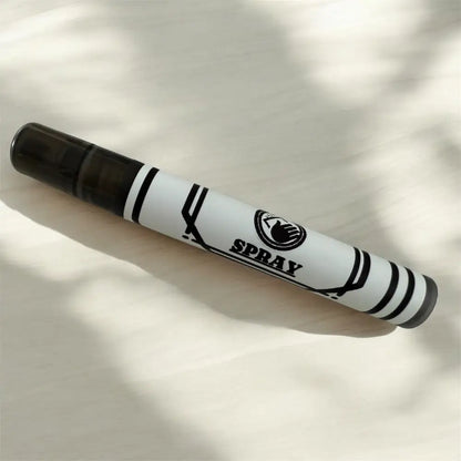 White spray bottle with black cap and bold black stripes, featuring a minimalist logo and ’spray’ text on its cylindrical body.