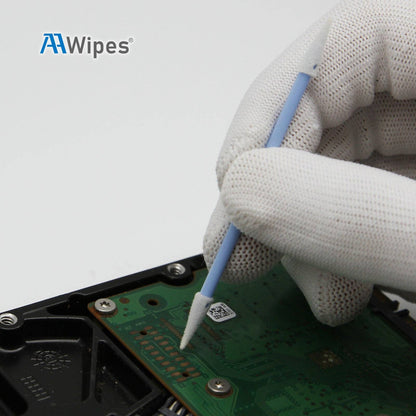 A close-up of a gloved hand using a blue and white cleaning swab to clean a green circuit board on a hard drive, with the AAWipes logo in the top left corner.
