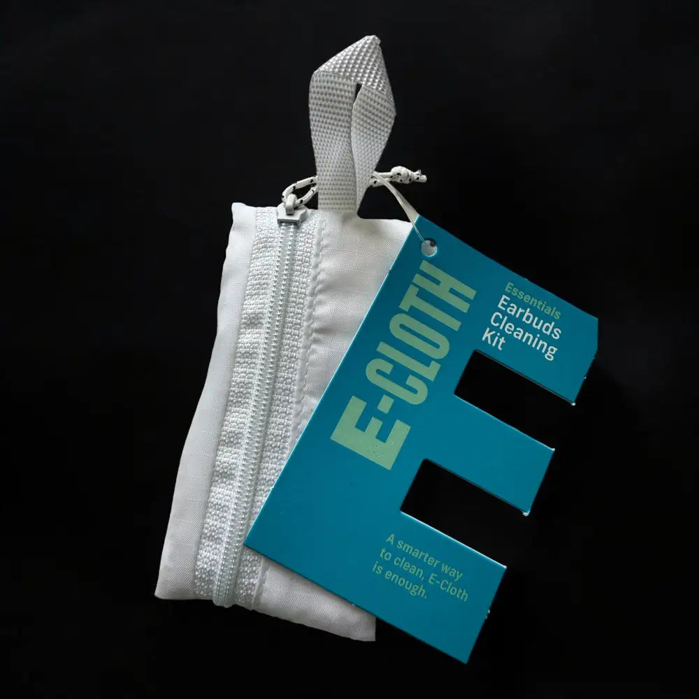 White zippered fabric pouch with a textured white strap and teal tag labeled ’e-cloth essentials earbuds cleaning kit.’