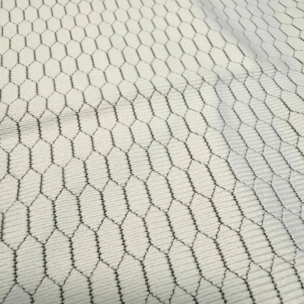 White fabric with a black hexagonal mesh pattern.
