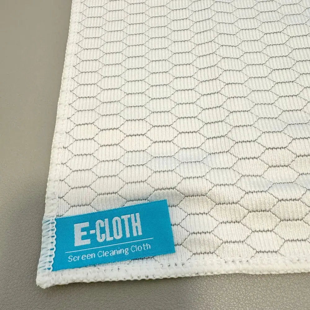 White hexagonal-patterned e-cloth screen cleaning cloth with a blue label.