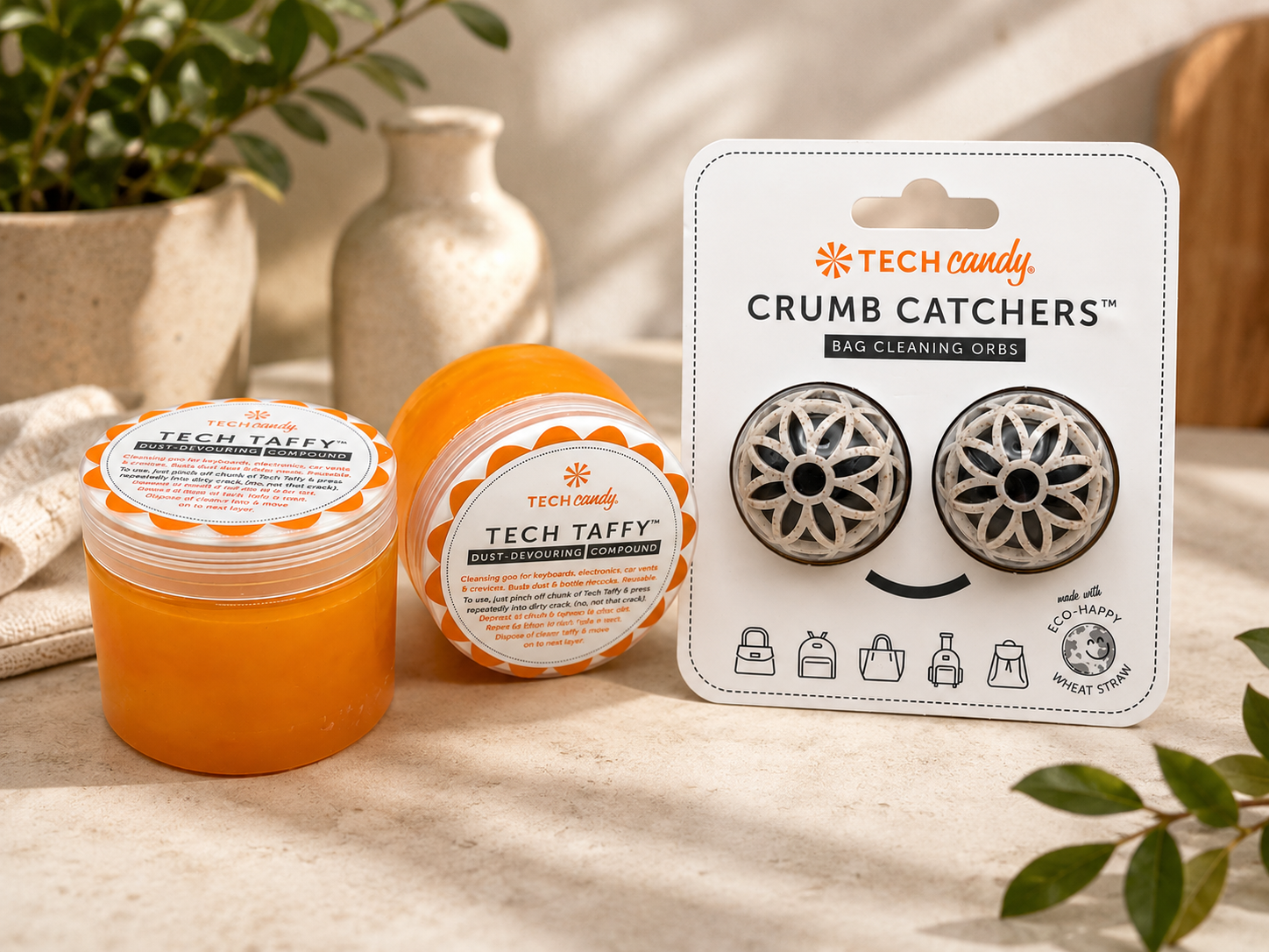 Tech Taffy and Crumb Catchers packaging on a neutral background with decorative elements.