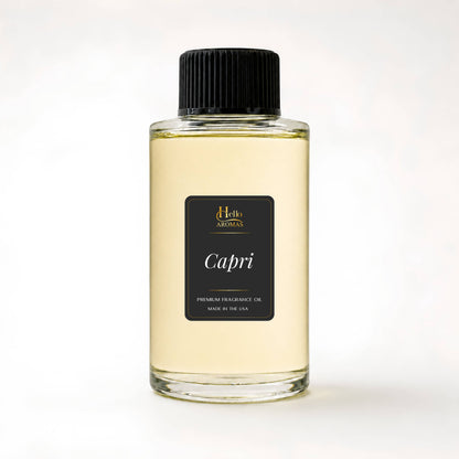 Bottle of 'Capri' fragrance oil with a black cap on a white background