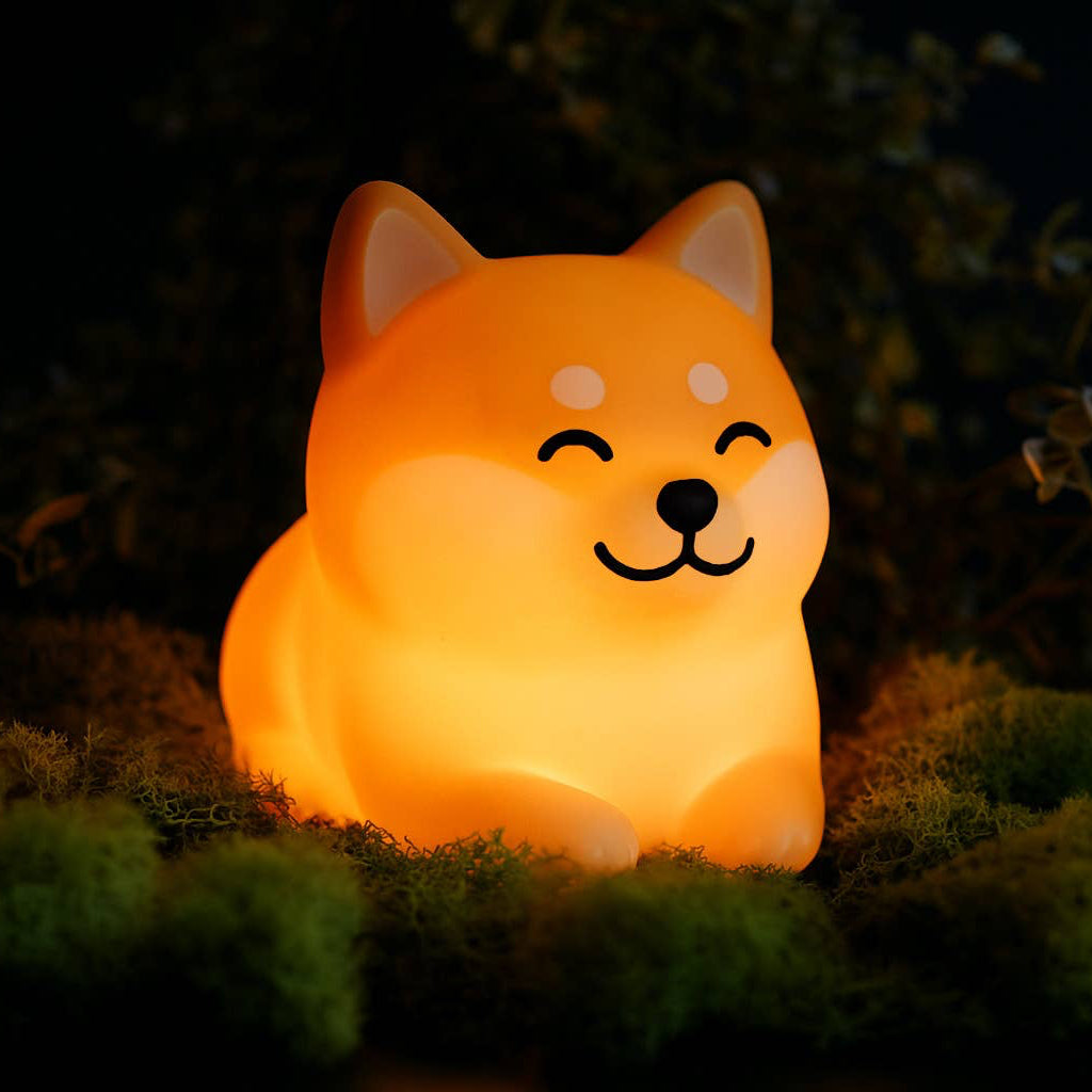 Cute dog-shaped night light glowing in the dark outdoors.