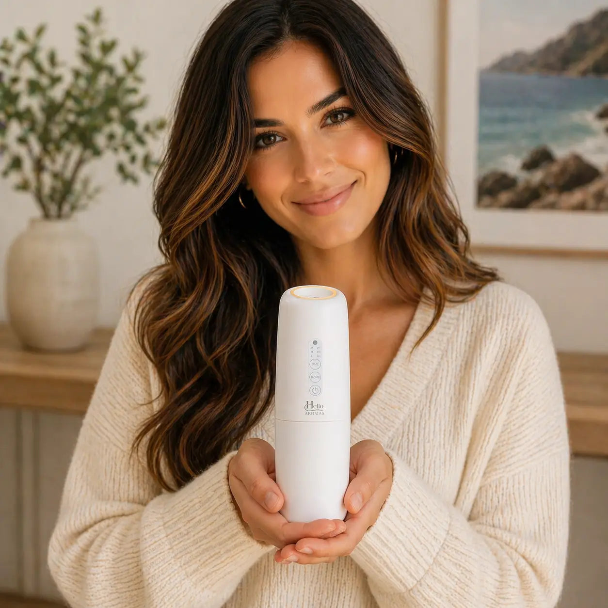 White cylindrical oasis plug-in scent diffuser with minimalist design and subtle branding by hello aromas