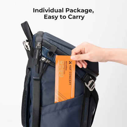 Orange k&f concept microfiber cleaning cloth in a sleek package, nestled inside a navy blue backpack.