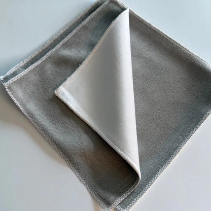 Gray microfiber cleaning cloth with a soft white interior and neatly stitched edges.