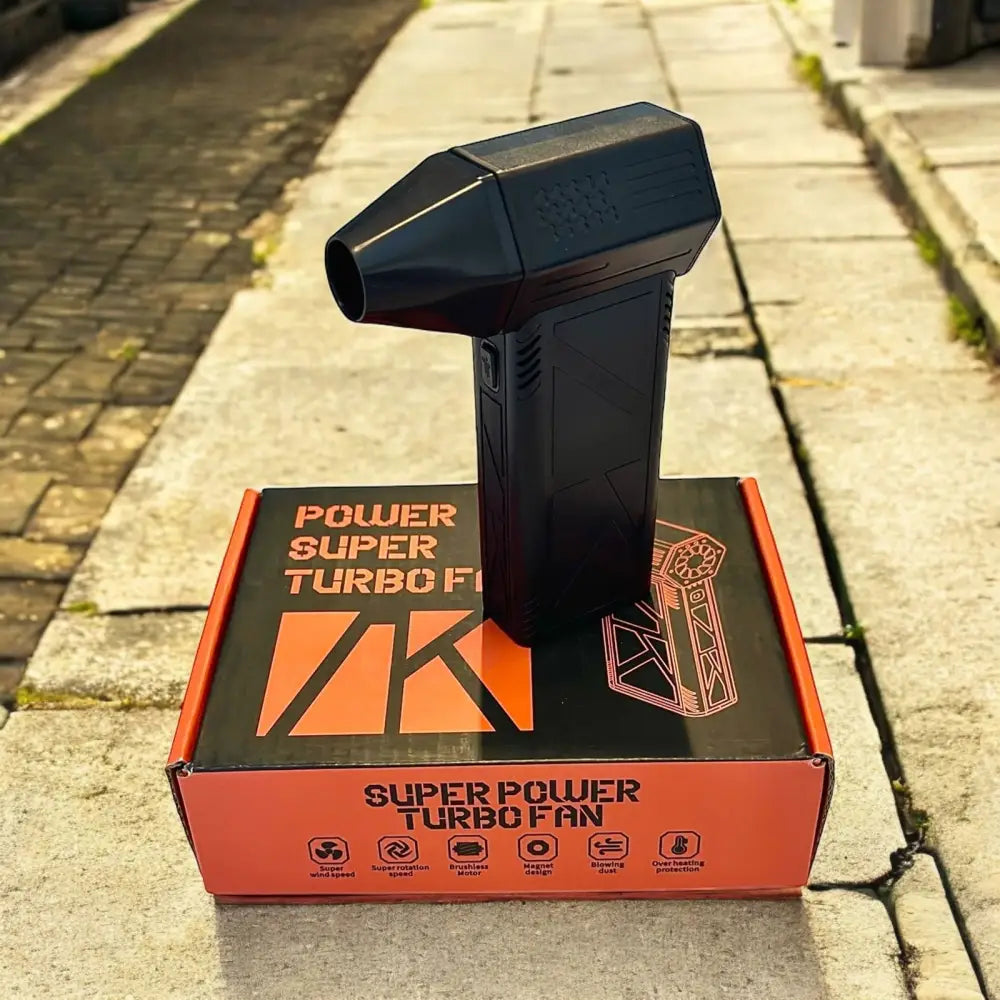Black plastic super power turbo fan with a sleek, angular design and textured grip.