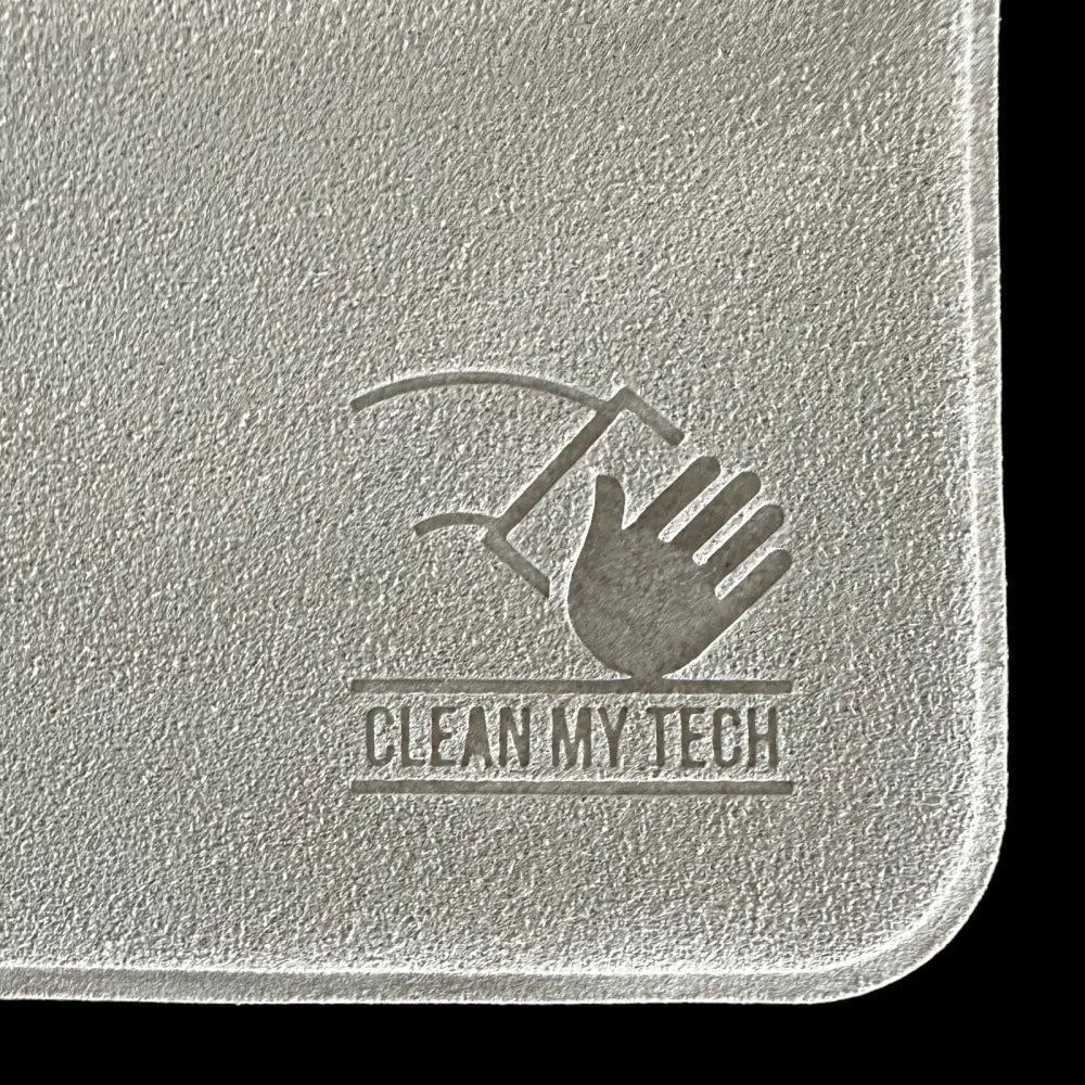 Silver textured cleaning pad with embossed logo featuring a hand and tool.