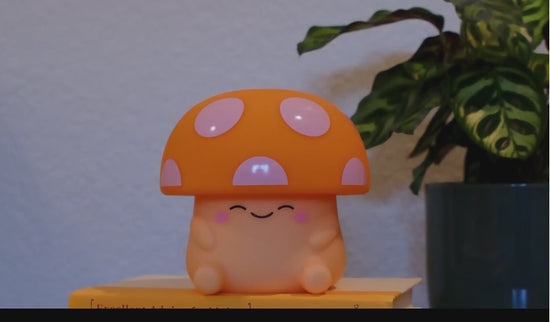 A hand taps the top of mushroom light to demonstrate the brightness levels.