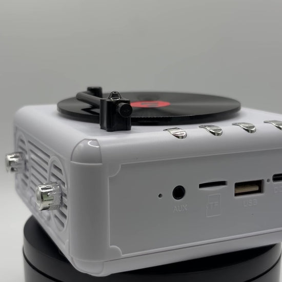 360 view of a white retro vinyl record player bluetooth speaker 