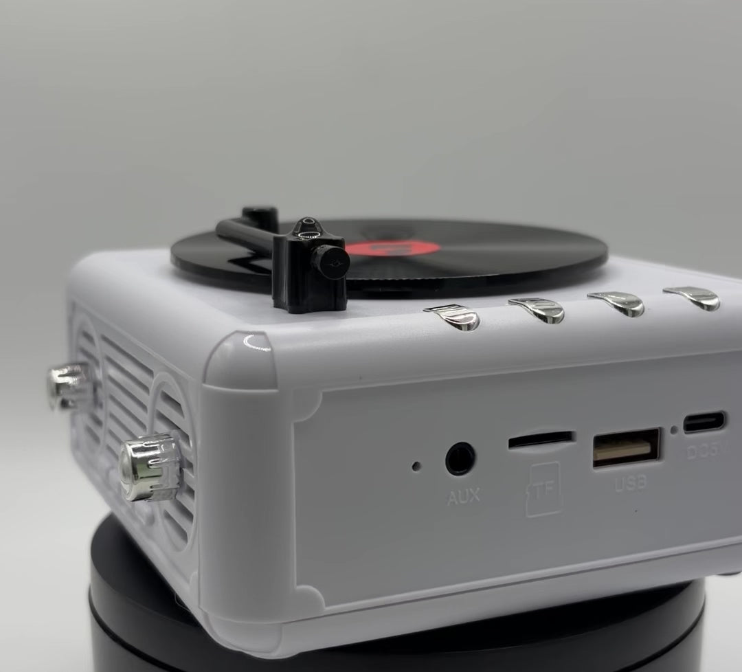 360 view of a white retro vinyl record player bluetooth speaker 
