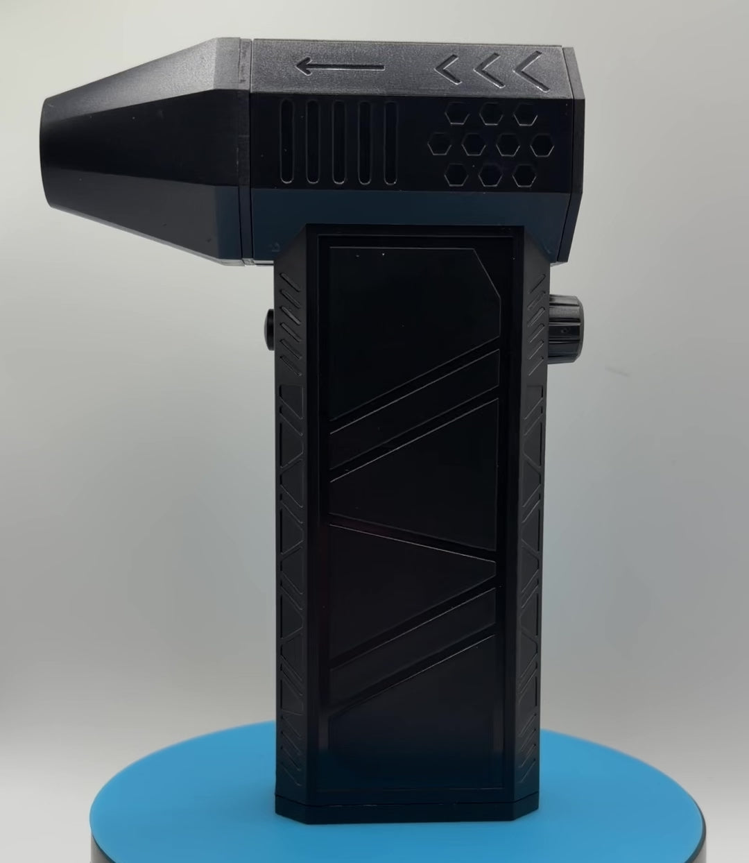 Powerful 130,000 RPM Electric Air Duster with Adjustable Speed Control rotating on a blue pedestal 